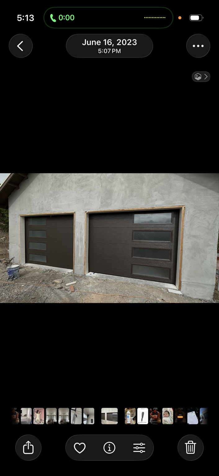 Two brown garage doors with vertical rows of windows